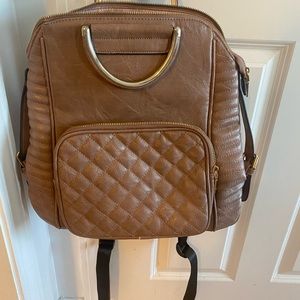 mauve backpack with gold accents. super cute !